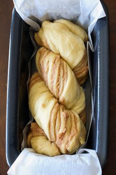 several pieces of bread in a pan on a table