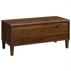 a wooden chest with two drawers on it