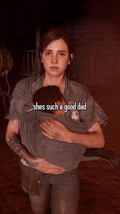 a woman holding a child with the caption she's such a good dad