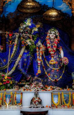 an idol is displayed in front of a shrine