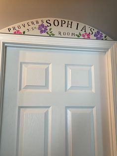 a white door with a sign above it