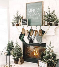 christmas stockings hanging from the fireplace mantle