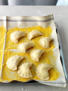 some kind of food that is sitting on a pan with yellow stuff in it's middle