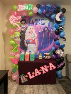 a birthday party with balloons, decorations and an image on the wall behind it that says happy birthday lanana