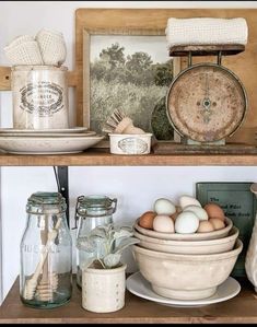 an old fashioned kitchen shelf has eggs and other items on it