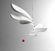 a modern chandelier hanging from a ceiling in the shape of an abstract flower