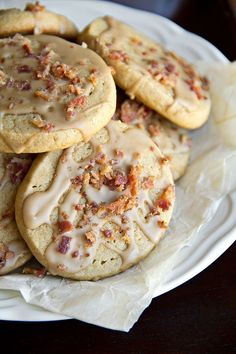 a white plate topped with cookies covered in frosting