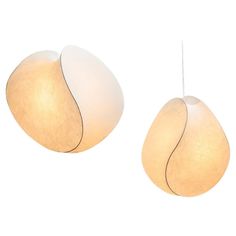 two white lamps hanging from the ceiling