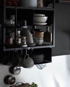 pots and pans are hanging on the wall