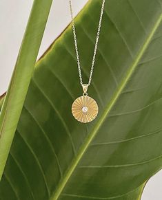 Gold Sun Necklace is carefully hand-crafted inspired by the sun.  The sun represents life, energy, positivity, clarity, confidence, and more. This dainty silver chain necklace crafted from 925 silver and has 14K solid gold plating will maintain its brilliance over time.  If you are looking for a gift for your girlfriend, this delicate necklace is a perfect unique gift for her.  Color: Gold Material: 14K Gold Platting, Silver Package contains: 1 Gold Sun Necklace Check the below link for more: https://www.etsy.com/shop/MaisonNoura Elegant Round Sun Design Jewelry, Elegant Sun Design Necklace, Elegant Sunburst Jewelry With Sun Design, Elegant Sun Design Pendant Necklace, Elegant Yellow Gold Sun Design Necklace, Elegant Sunburst Jewelry With Sun And Moon Design, Elegant Sun And Moon Design Sunburst Jewelry, Elegant Round Pendant Jewelry With Sun Design, Elegant Round Pendant With Sun Design