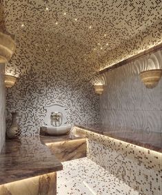 an artisticly designed bathroom with white and brown tiles on the walls, counter tops and sinks