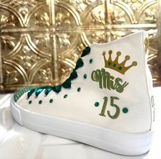 Pick your own colors and Personalized Dancers Sneakers for your Quinceañera. Remember to add your name and the date of the event on the Personalization tab. Perfect match for that dress, don’t forget to ask us for a matching Tiara - Crown. You can search in our Etsy store - GuiltychicPrint for more information about our reviews.🌟Includes🌟- Pick shoelace colors.- The toe top is covered with bright rhinestones.- On the sides of the shoe (right & left), the idea/name/date is printed in solid or g Quinceanera Green, Quince Party, Quinceanera Shoes, Personalized Sneakers, Blue Crown, That Dress, Tiara Crown, 15 Gifts, Blue Party