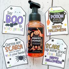 three halloween gift tags and a bottle of booze on a white wood background with free printables