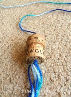 a cork with blue string attached to it