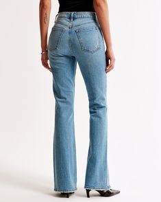 Step back in time with the Abercrombie & Fitch Women's High Rise Vintage Flare Jeans, a perfect blend of retro style and modern comfort. These jeans are designed to flatter with a 10.5” high rise and a silhouette that fits snugly at the waist and hips, relaxes slightly at the thigh, and then eases into a full-length flared leg. 

- Size: 34 LONG
- Color: Medium Wash
- Material: Vintage stretch fabric, Pocket Bag: Polyester, Cotton
- Gender: Female
- Age Group: Adult

Crafted from a vintage stret Relaxed Fit High-waisted Cotton Flare Jeans, Stretch Medium Wash Full-length Flare Jeans, Abercrombie Ultra High Rise Vintage Flare Jeans, Vintage Flare Jeans, Medium Wash Non-stretch Cotton Flare Jeans, Affordable Button-detail Flare Jeans, High Rise Flare Jeans, Vintage Flare, Women's Bottoms