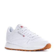 This Reebok Classic Leather with the gum sole is the most stylish and timeless sneaker to hit shelves. Featuring lightweight cushioning and a low-cut design, this casual men's sneaker is perfect for all-day wearing and versatile styling. Dress this sneaker up in slacks or dress them down with sweatpants and a fitted tee. Soft leather upper. Removable sockliner accommodates orthotics. Die-cut EVA midsole for lightweight cushioning. High abrasion rubber gum outsole for durability. Imported. Classic Sports Sneakers With Gum Sole, Comfortable Sneakers For Streetwear With Gum Sole, Classic Synthetic Sneakers With Gum Sole, Casual Running Shoes With Gum Sole For Sports, Reebok Classic Leather, 5 Kids, Fitted Tee, Reebok Classic, Classic Leather