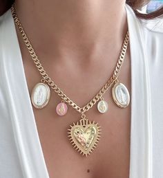 Gold filled Sacred Heart and Miraculous virgin necklace  MATERIAL AND SIZE: 18k Gold filled chain 18k Gold filled sacred heart medal Medals size: Sacred Heart: 3.5x3.2cm Pink and white Virgin Mary: 1cm Silver and gold Virgin Mary: 2.5x1.5cm Length of your preference Miraculous Medal Jewelry Gift For Mother's Day, Miraculous Medal Necklace For Mother's Day Gift, Mother's Day Gift Jewelry With Miraculous Medal, Gold Plated Spiritual Necklace With Miraculous Medal, Spiritual Gold Plated Necklaces With Miraculous Medal, Gold Plated Miraculous Medal Jewelry As Gift, Heart Shaped Miraculous Medal Jewelry Gift, Heart-shaped Miraculous Medal Jewelry Gift, Virgin Necklace