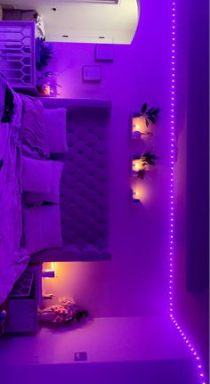 a bed with purple lights in a room