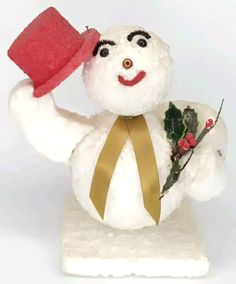 a snowman with a red hat and scarf holding a candy cane in his hand