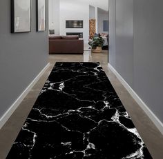 a black and white marble floor in a hallway