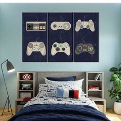 three video game controllers mounted to the wall above a bed in a room with blue walls