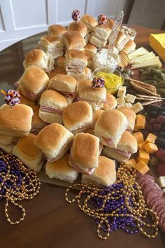 a table topped with lots of different types of sandwiches and crackers on top of it