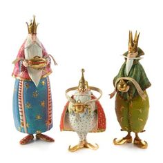 three figurines in different colors and sizes, one with a crown on its head