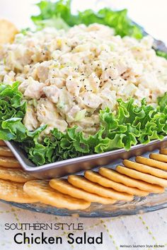 a platter with chicken salad and crackers