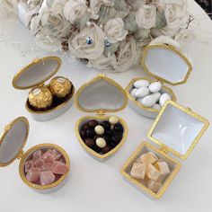 an assortment of candies and chocolates displayed on a table