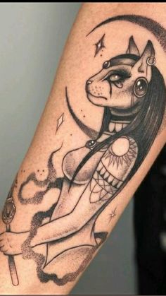 a woman with a dog tattoo on her arm