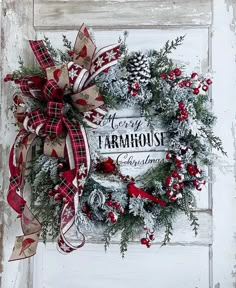 a christmas wreath hanging on the side of a door