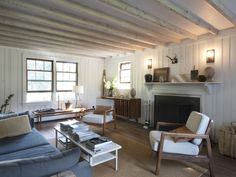 a living room filled with furniture and a fire place