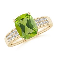 This moss-green cushion peridot ring in 14k yellow gold is a statement piece. The diamonds pave-set on the shank lend a sparkling touch to this stunning prong-set peridot cocktail ring. Peridot Rings, Green Cushions, Cushion Ring, Ring With Diamond, Peridot Ring, Moss Green, Cocktail Ring, Cushion Cut, Cocktail Rings