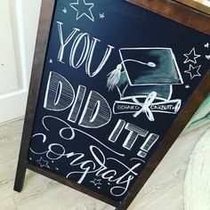 a chalkboard with the words you did it like graduation written on it and a graduate's cap