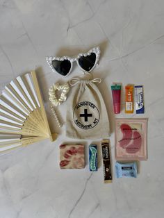 the contents of a travel kit laid out on a marble surface