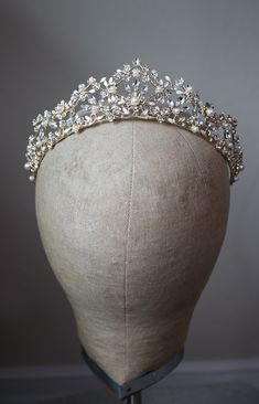 RENEE Pearl and Crystal Wedding Tiara WHAT WE LOVE: The Renee Wedding Tiara exudes elegance and beauty with its absolutely stunning sparkle. This tiara is an excellent choice for both Classic and Royal Brides. DETAILS: Austrian Crystals Creamy Faux Pearls Rhodium Plating There are pin loops at the ends for added security while you are dancing the night away at your wedding! Tiara at its tallest part : Approximately 1.75 inches (4.4 CM) Comes in a Beautiful EDEN LUXE Bridal Signature Beribboned K Bohemian Veils, Dark Romantic Wedding, Ethereal Jewelry, Crystal Wedding Tiaras, Floral Veil, Silver Head Piece, Tiara Bridal, Silver Tiara, Gold Headpiece