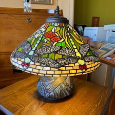 a lamp sitting on top of a wooden table