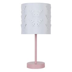 a pink table lamp with a white shade on it's base and butterfly cutouts