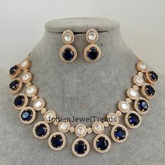 Blue Gold Victorian uncut polki CZ Necklace, Sabyasachi Necklace, Statement Necklace, Semi Precious Necklace, Designer,Indian Pakistani Gold Plated  Necklace Length 16 inches with adjustable chain closure  Earrings Length = 1.2 Inches Regular size and adjustable.  Ships from California in 1 business day and delivery within 2-5 business days in the USA.  Color, shades, and texture displayed may vary slightly from the actual product due to digital image limitations. We request you to consider these minor variations. Please expect the possibility of some slight imperfections when buying handmade jewelry.  Please let me know if you have any questions. Arrives in a gift box. Thank you so much for visiting my shop. Blue Cutdana Necklace Bollywood Style, Blue Cutdana Necklaces For Diwali, Blue Cutdana Necklace For Diwali, Blue Hand Set Necklace For Diwali, Heavy Blue Bollywood Necklaces, Formal Blue Kundan Necklace, Festive Blue Necklace, Semi Precious Necklace, Cz Necklace