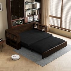 a bed sitting on top of a hard wood floor next to a wall mounted cabinet