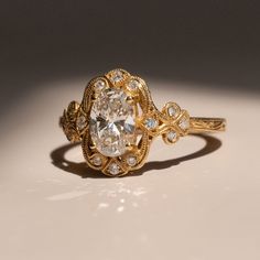 An undeniably beautiful ring inspired by the Victorian era.    Materials - 14k Yellow Gold, Lab-Grown Diamond (IGI Certified) Weights - 1.00ct lab grown Diamond, 0.14ct Melee Diamond Diamond Specs Cut - Oval Color - G Clarity - VS1 Dimensions - 8mm x 5mm x 3 Size - 6.5 Victorian Wedding Ring, Pretty Wedding Rings, Victorian Style Rings, Victorian Diamond Ring, Delicate Engagement Ring, New Victorian, Pretty Engagement Rings, Victorian Engagement Rings, Wedding Ring Styles