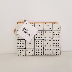 The most adorable zippered pouch in domino print. This pouch is made from linen cotton canvas + cotton poplin lining + stabilizing Pellon + metal zipper. Sizing (in inches) Coin Purse : 5.5 x 5 Square Pouch : 6.5 x 6.5 Medium Pouch : 7.5 x 5.5 Clutch Bag : 9 x 6 Please note that the liner and zipper color may vary from that in the photos but will always be a coordinating fabric and zip. Find the Sunny Stripe boxy makeup bag here: https://www.etsy.com/listing/1305626243 Find more great Fern & Arr Canvas Cosmetic Bag, Zipper Pouches, Purse Gift, Bag Makeup, Zippered Pouch, Boho Gifts, Best Friend Gift, Zipper Bag, Accessory Pouch