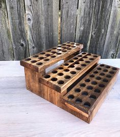 "FREE SHIPPING in the USA This beautiful Stadium style shelf will store 72 roller balls. The dimensions are 12 1/2\"wide x 4 1/2\" tall x 11 1/4\" deep We have many color finish options to choose from" Essential Oils Organization, Oil Rack, Essential Oil Box, Essential Oil Shelf, Essential Oil Holder, Essential Oil Roller Balls, Wood Shelving, Barn Wood Projects, Diy Essentials