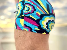 A zippy geometric in bright blue, purple, puce and white, this print puts forward your best curves. 225 pieces made. Blue Swim Trunks With 4-way Stretch For Swimming, Blue 4-way Stretch Swim Trunks For Swimming, Blue Moisture-wicking Sportswear Swim Trunks, Multicolor Moisture-wicking Swim Trunks, Multicolor Swim Trunks With Built-in Shorts, Bright Blue, Swim Trunk, Flower Power, Swimming