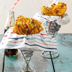 two baskets filled with food sitting on top of a wooden table