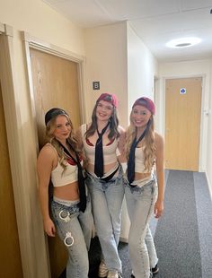 three young women are posing for the camera