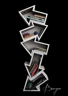 a book shelf filled with books on top of a black background and an arrow symbol above it