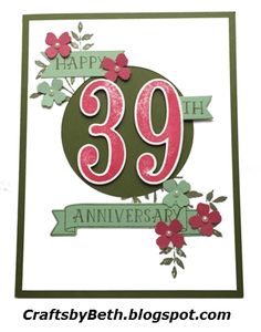 a birthday card with the number 399 on it and flowers in green, pink and red