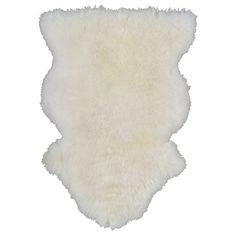 a white sheepskin rug on a white background