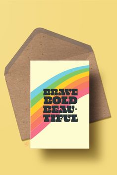 a greeting card with the words brave bold beautiful on it in black and rainbow colors